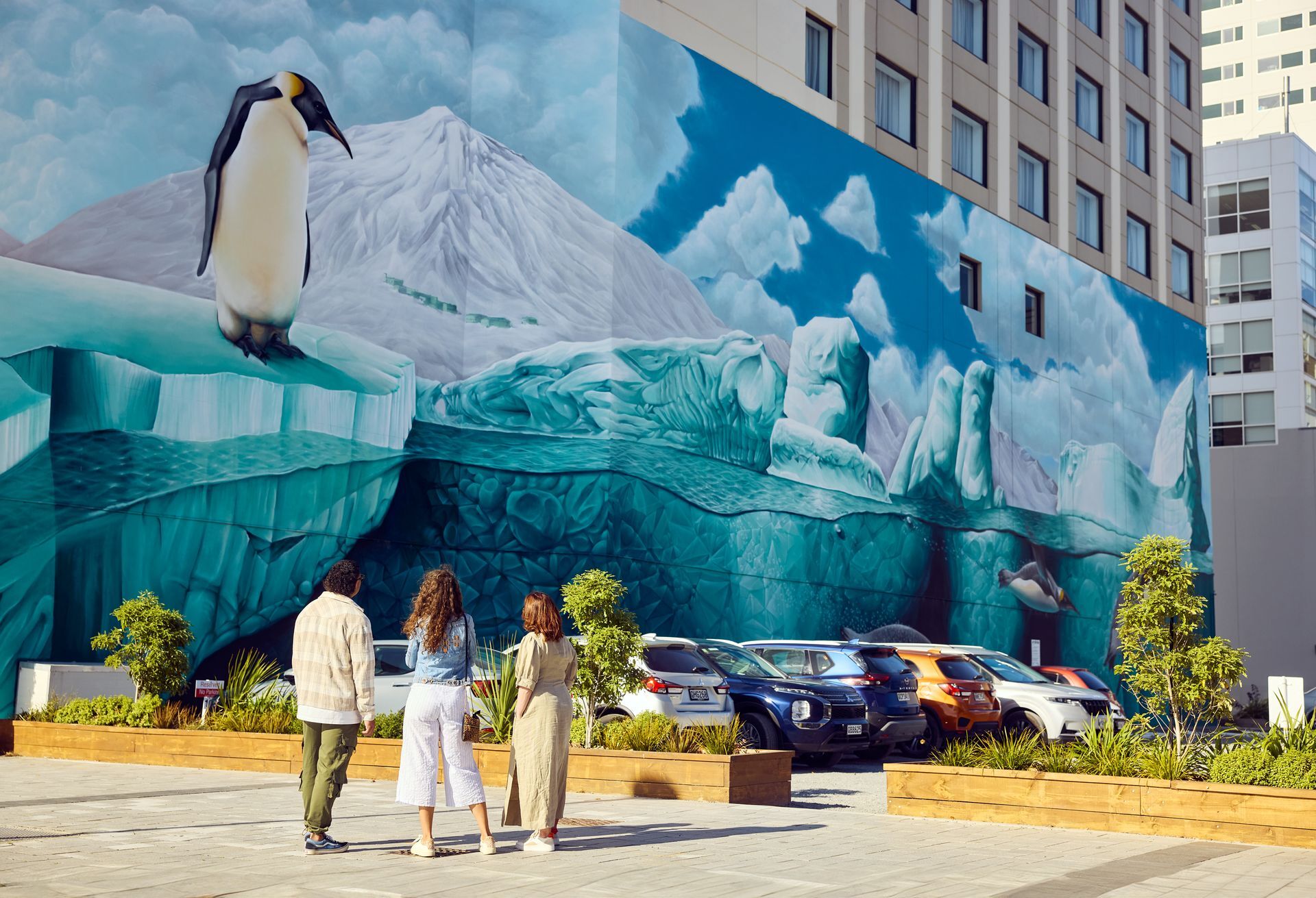 Christchurch 551382 three friends admiring the antarctic mural web 1920px jpg
